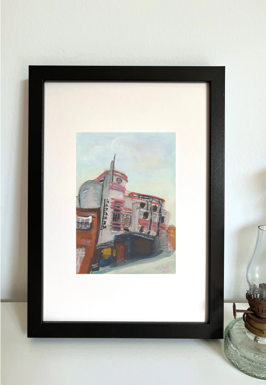 Framed painting of Garagem Passos Manuel in Porto with pale blue sky.