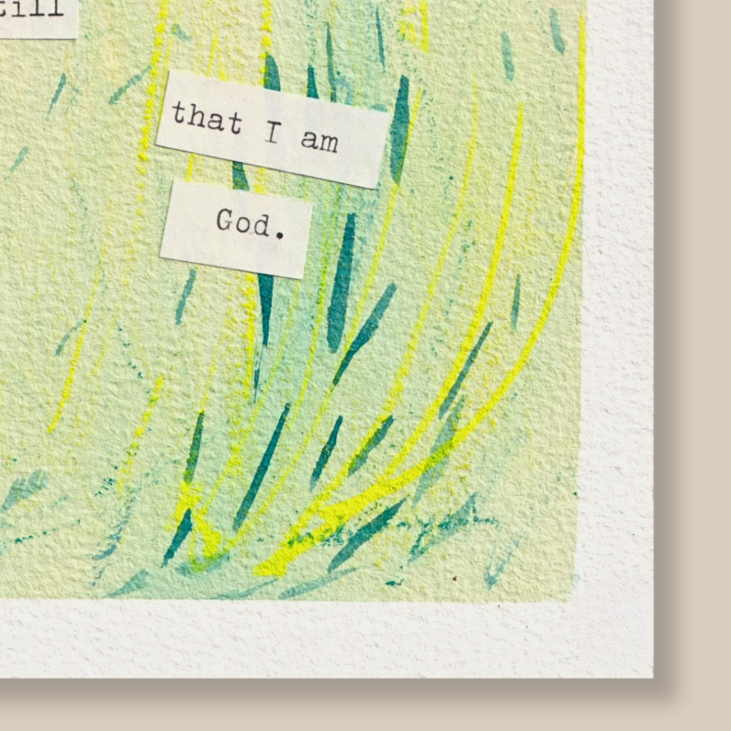 Close up of abstract painting with typewritten text 'be still and know that I am God' on a textured watercolour paper