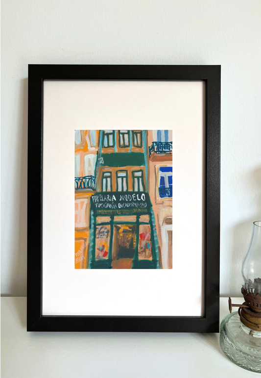 Framed colorful painting of building facade with Papelaria Modelo store sign in historical centre of Porto