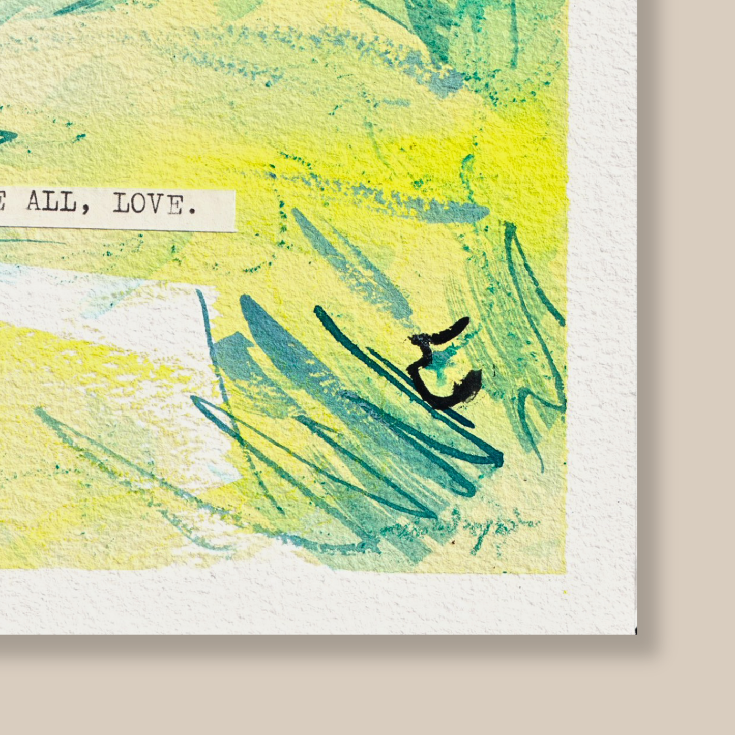 Close up of abstract mixed media painting with typewritten text 'Above All, Love' on a textured cold-pressed watercolour paper on a beige background
