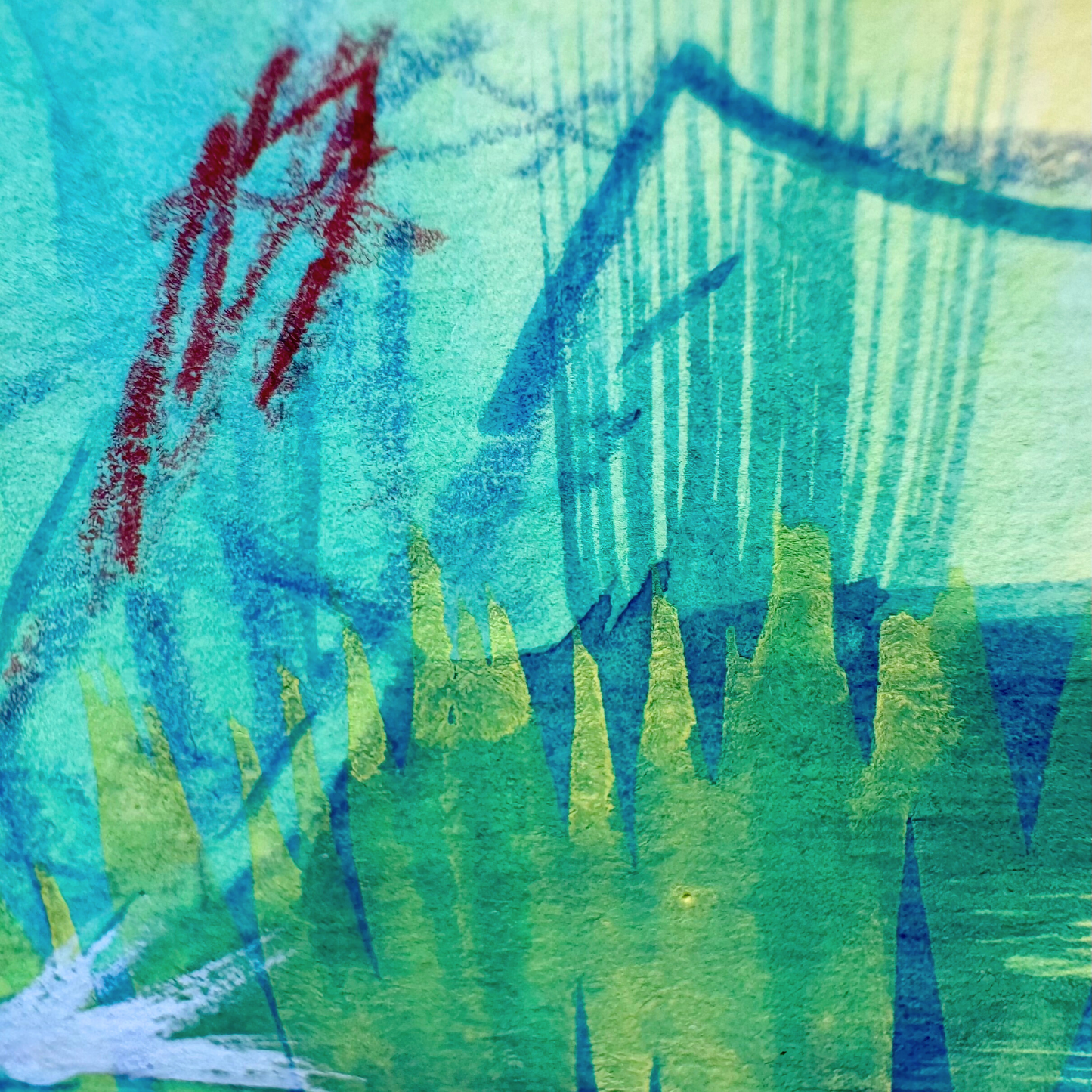 Close up of abstract artwork with blue, green, and red colors