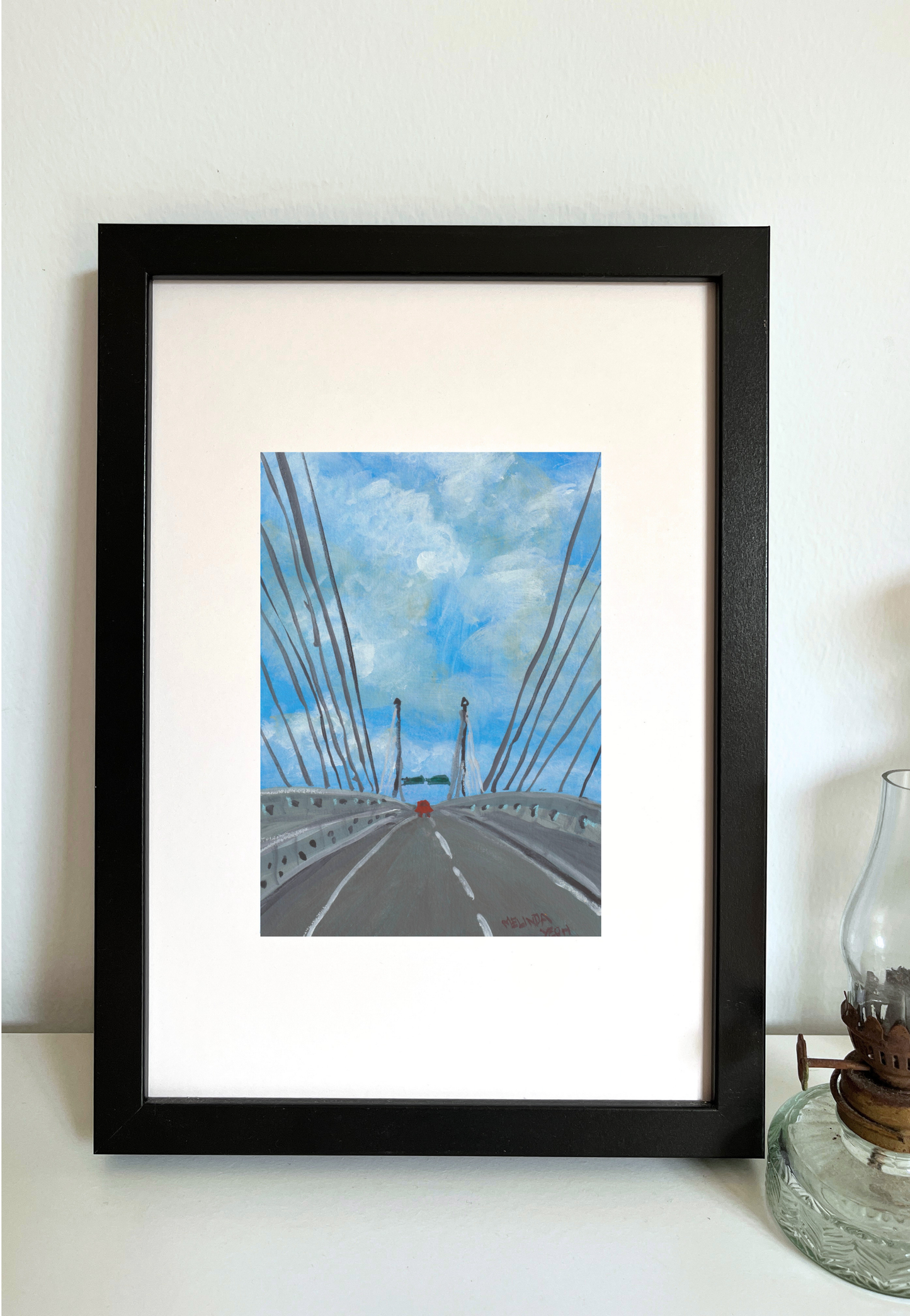 Framed artwork of Penang Second bridge with a blue sky and clouds.