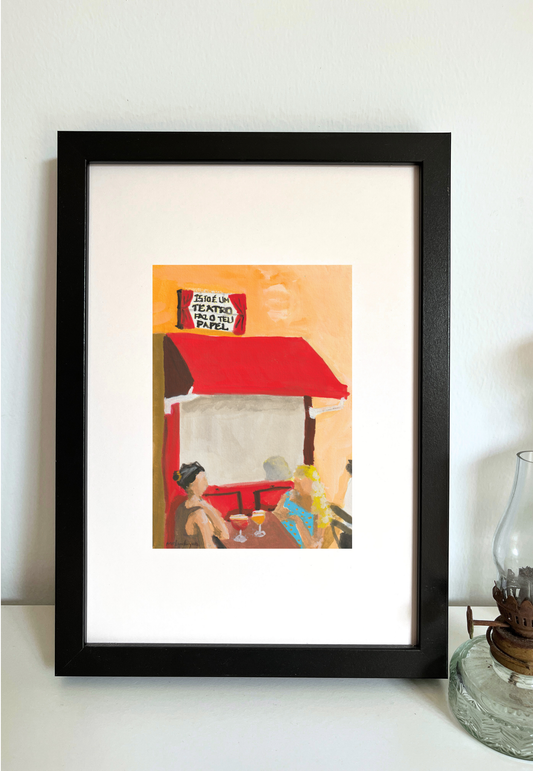 Framed painting of outdoor cafe scene with red awnings and people sitting, featuring a sign in Portuguese.