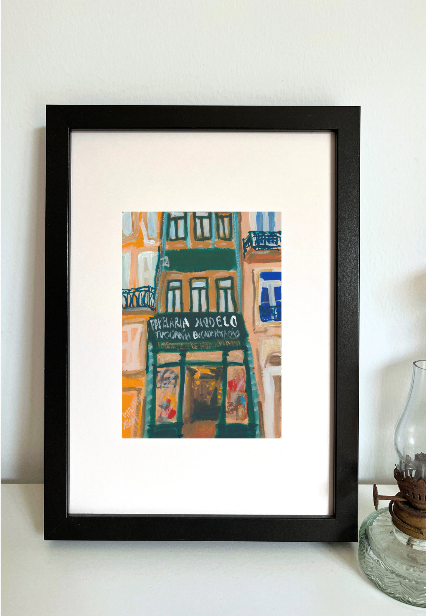 Framed colorful painting of building facade with Papelaria Modelo store sign in historical centre of Porto
