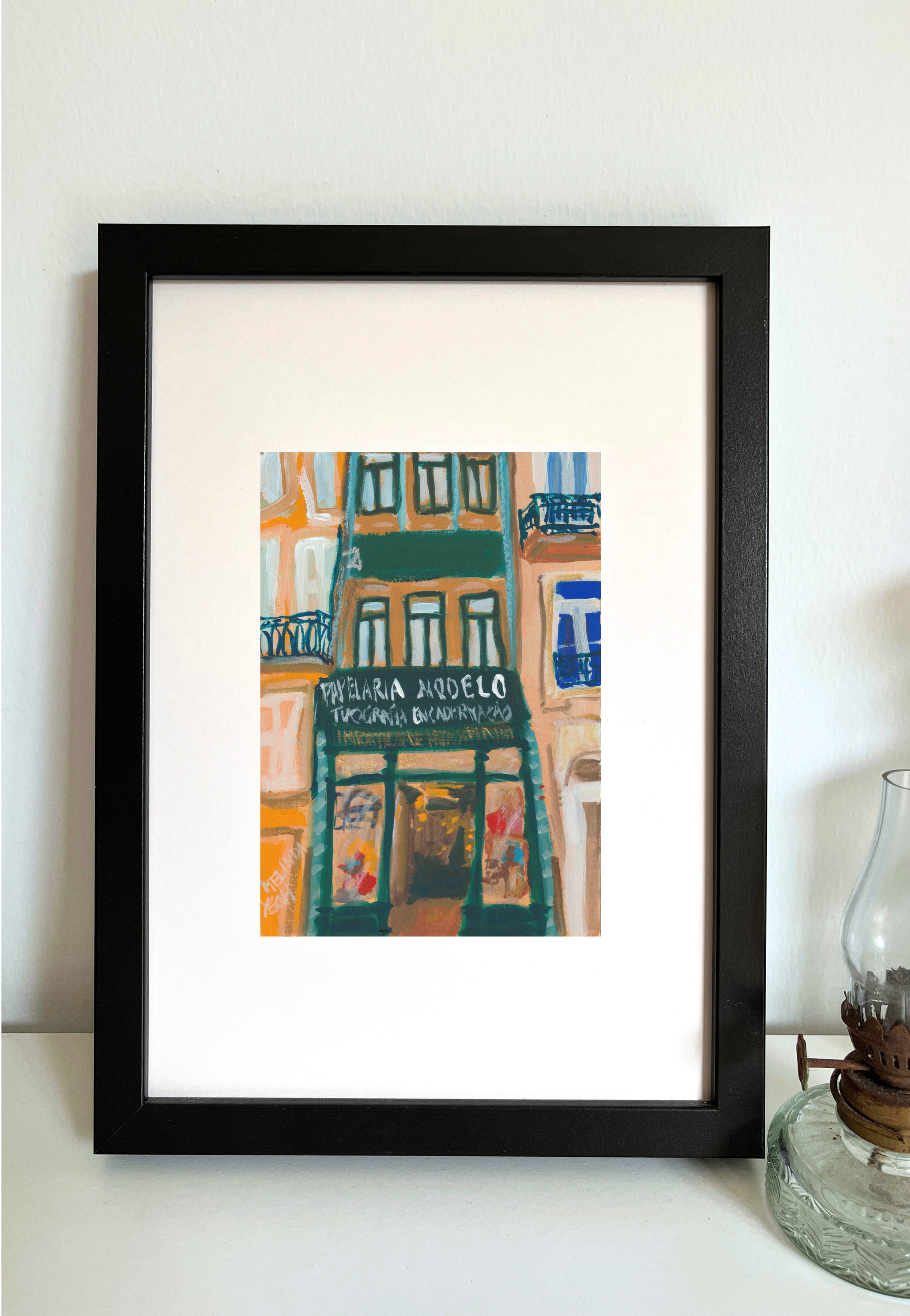 Framed colorful painting of building facade with Papelaria Modelo store sign in historical centre of Porto