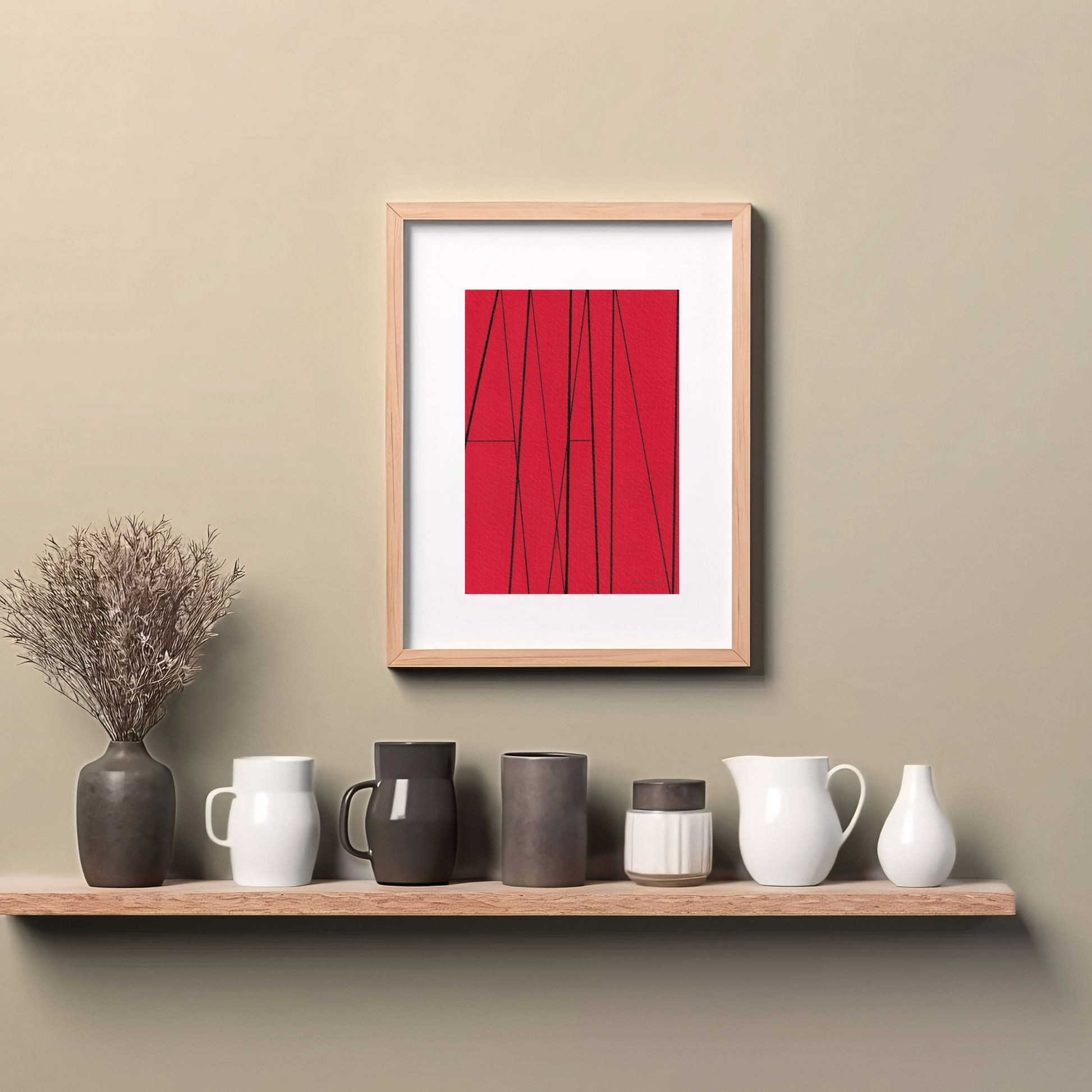 Framed red abstract art print with the word 'AMEN' in thin black lines, hanging on wall above a wooden counter top.