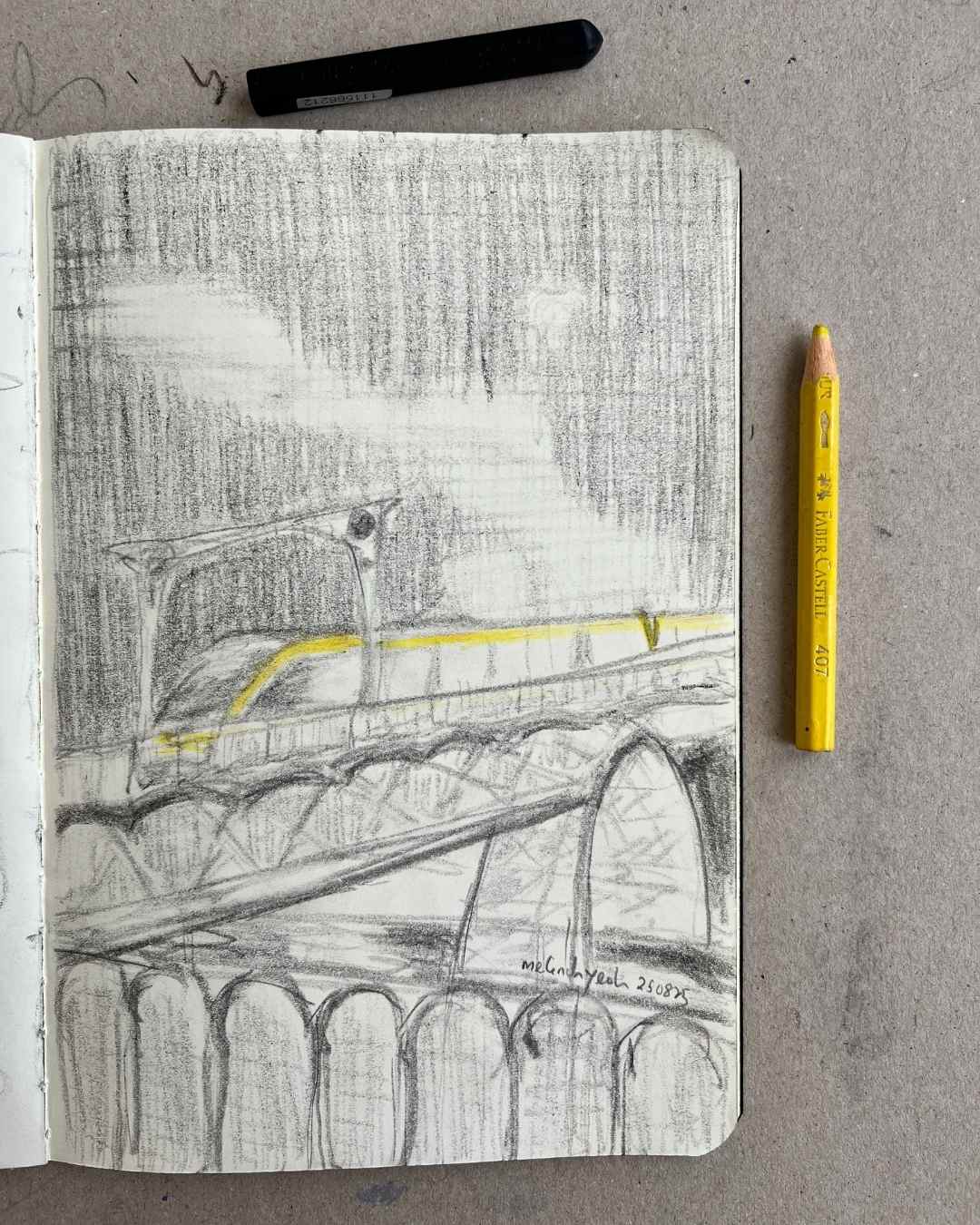Sketchbook with a pencil drawing of Porto Metro crossing Ponte D. Luís I by Melinda Yeoh art