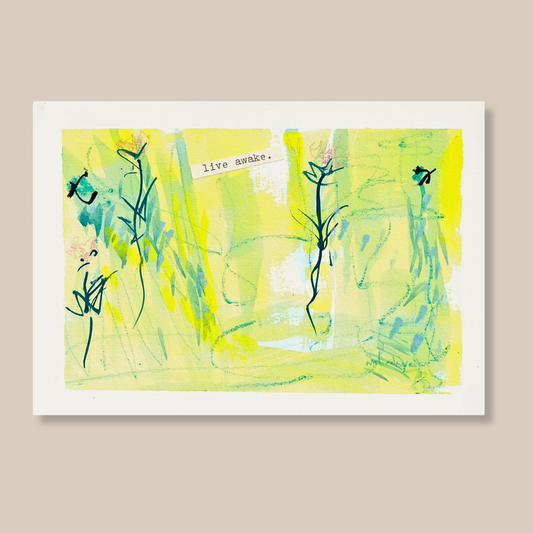Abstract mixed media painting with typewritten text 'Live Awake on a smooth hot-pressed watercolour paper on a beige background