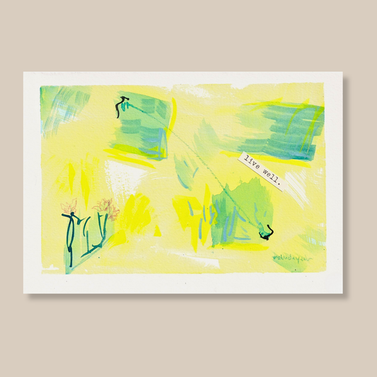 Abstract mixed media painting with typewritten text 'Live Well' on a smooth hot-pressed watercolour paper on a beige background