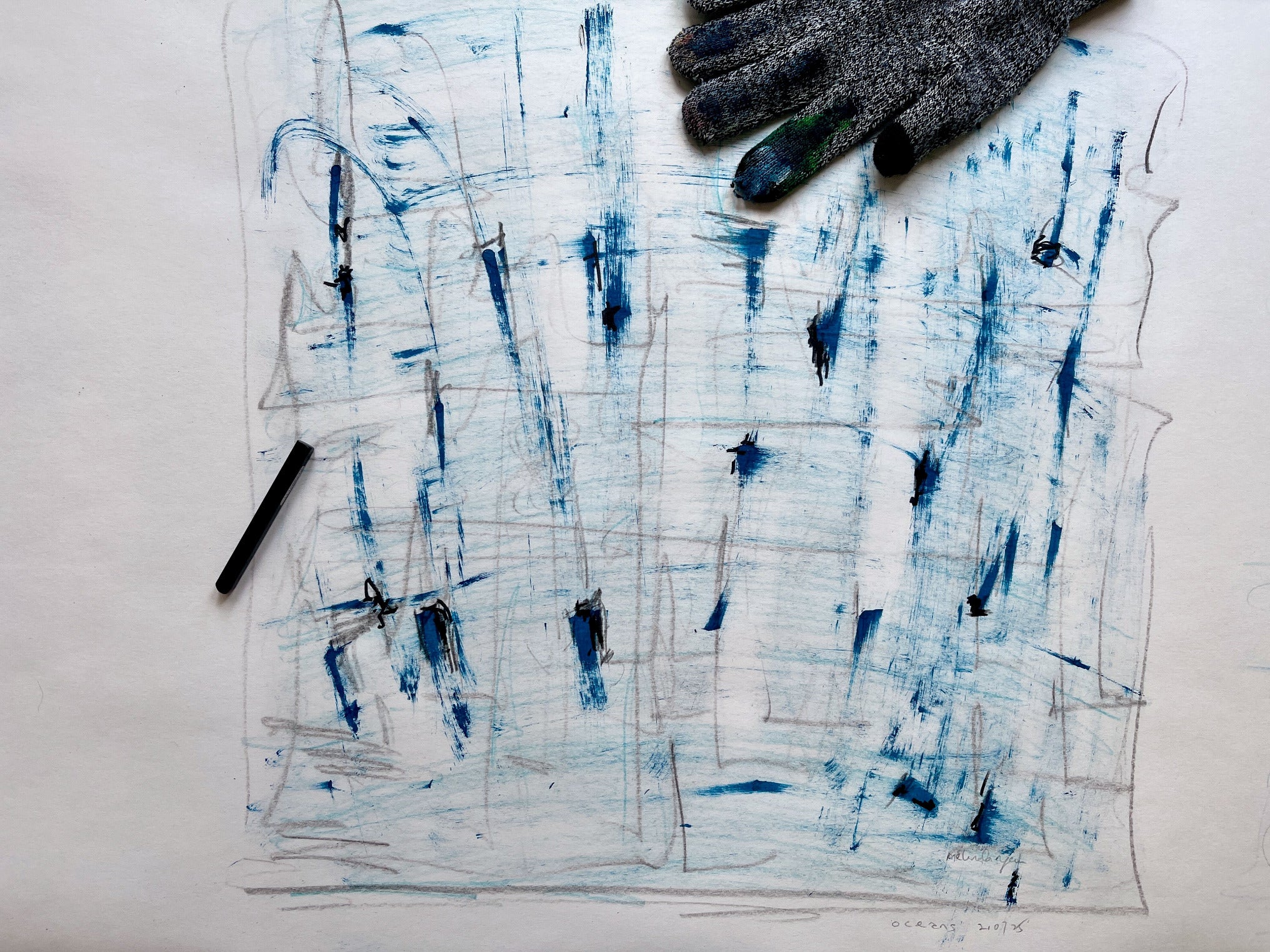 Abstract art piece with blue and black brush strokes on a white background, accompanied by a glove and a pen by Melinda Yeoh Art from monologue\worship/conversations series