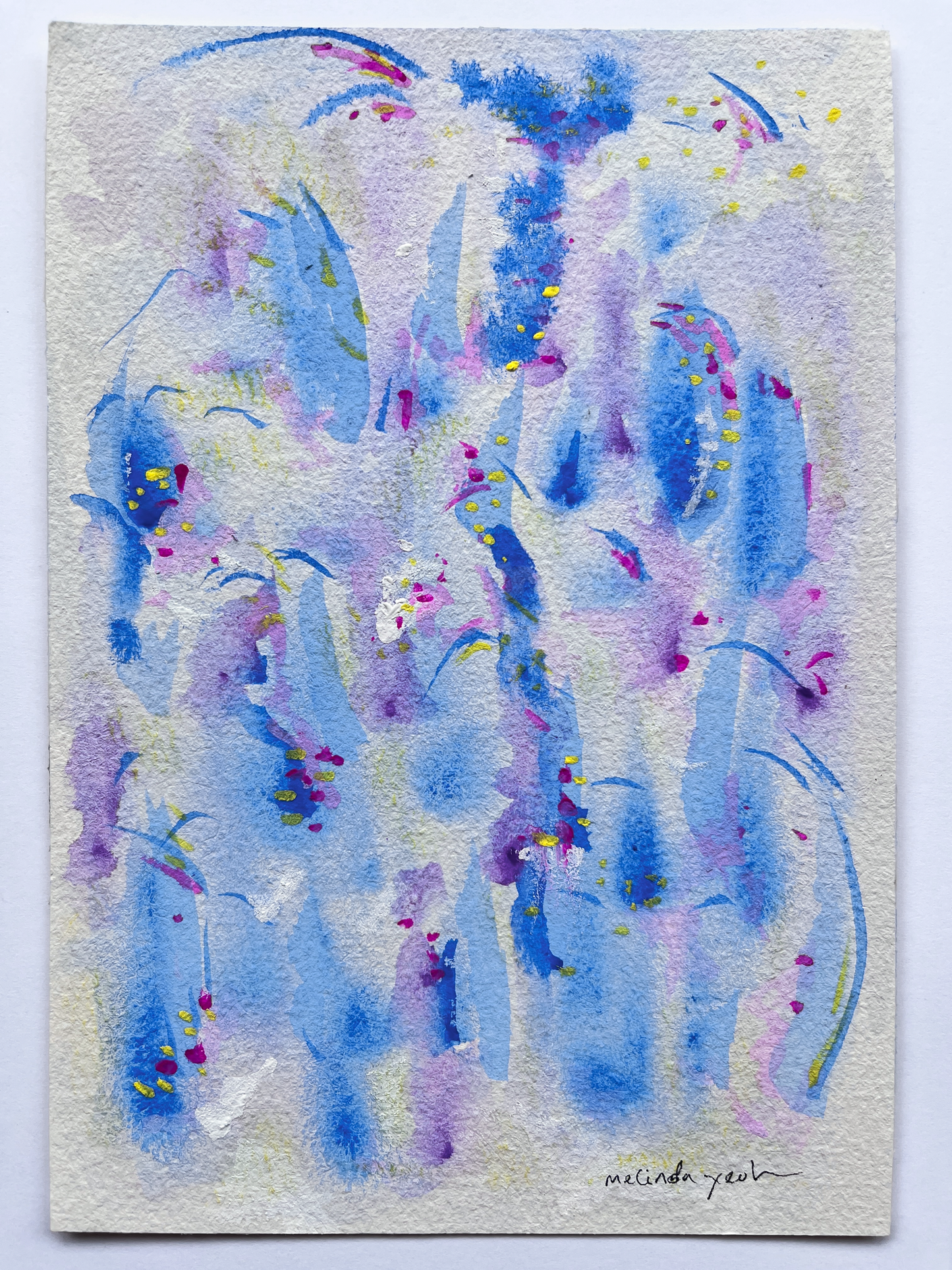 Acrylic gouache painting of blue and purple abstract marks on a watercolour paper