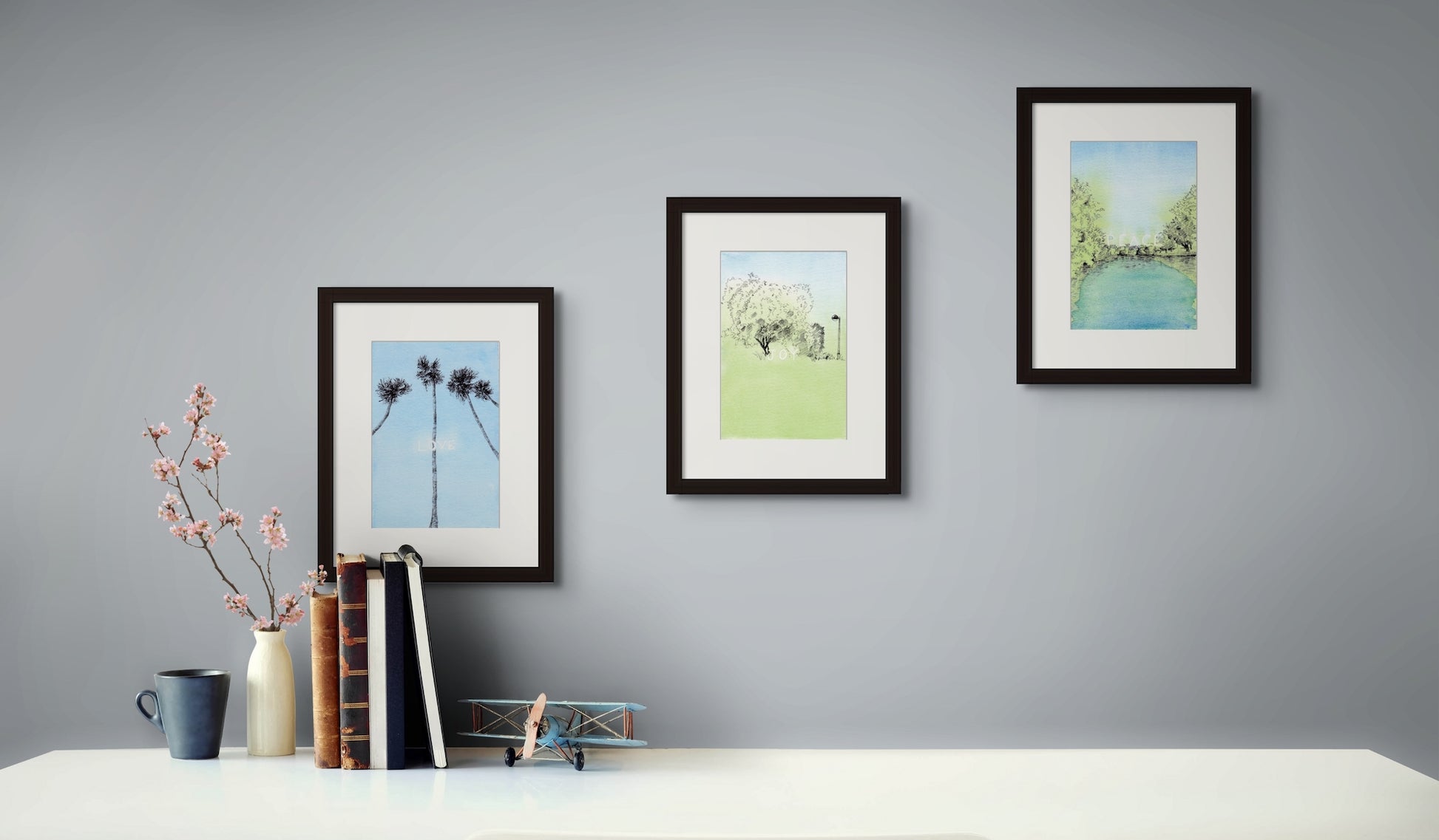 Image: set a three framed line drawing art prints of love, joy, peace in a home office
