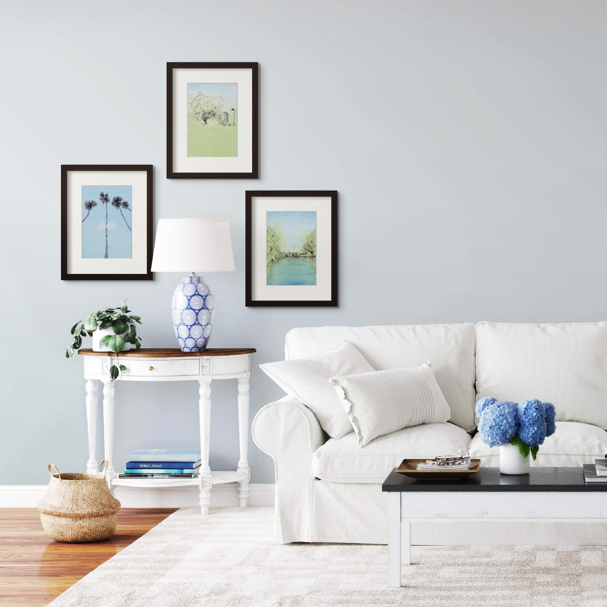 Image: Various line drawing with watercolour giclée art print with black frame and cream colour mat in a calm, white colour living room setting.